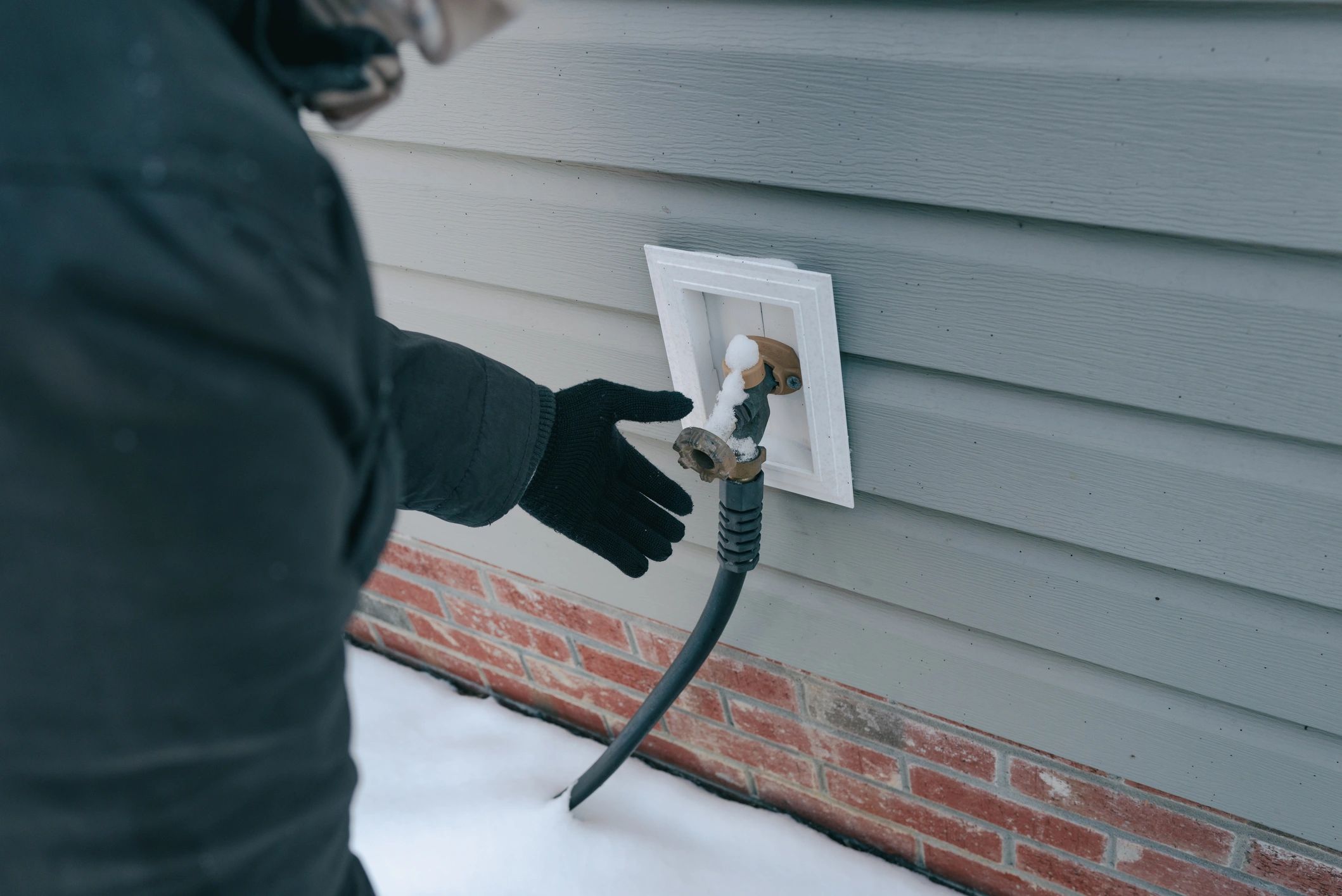 Outdoor plumbing fixture requiring inspection and repair